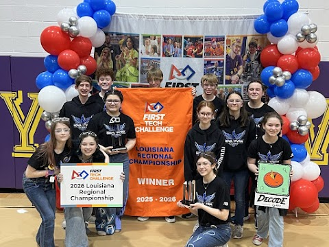 FTC 25619 Nova Pyra team members surrounding their robot 'Bullfrog' with their trophies after their successes at the 2024-2025 FTC LA Qualifier 1 at Hammond Crossroads